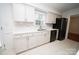 Bright kitchen with stainless steel appliances, white cabinets, and a window over the sink at 5925 Carmel Station Ave, Charlotte, NC 28226
