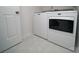 Clean laundry room with a new washer and dryer, plus modern flooring at 5925 Carmel Station Ave, Charlotte, NC 28226