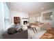Inviting living room with fireplace, neutral tones, and ample natural light from large windows at 5925 Carmel Station Ave, Charlotte, NC 28226