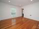 Hardwood floor living room with a window for natural light at 5925 Carmel Station Ave, Charlotte, NC 28226