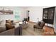 Cozy living room with stylish furniture, a round coffee table, and a decorative display cabinet at 5925 Carmel Station Ave, Charlotte, NC 28226