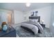 Serene main bedroom featuring a comfortable bed, soft colors, and stylish decorative accents at 5925 Carmel Station Ave, Charlotte, NC 28226