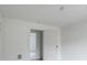 Bright room featuring a neutral paint scheme, an overhead light, and an open doorway at 609 Cedar St, Wadesboro, NC 28170