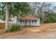 Charming home features a cozy front porch with a welcoming facade and a quaint, well-kept yard at 609 Cedar St, Wadesboro, NC 28170