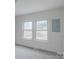 Bright living room featuring two windows letting in natural light and neutral carpeting at 609 Cedar St, Wadesboro, NC 28170