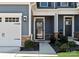 This front door features an elegant design, enhanced landscaping, and a welcoming entryway at 6231 Ashton Park Dr, Denver, NC 28037