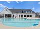 Inviting pool with an adjacent building and neat landscaping at 6231 Ashton Park Dr, Denver, NC 28037