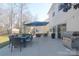 Backyard with a patio that includes a grill, dining set, and seating at 7001 Conifer Cir, Indian Trail, NC 28079
