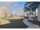 Scenic backyard with a patio, dining set, and well-maintained lawn at 7001 Conifer Cir, Indian Trail, NC 28079
