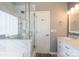 Bathroom featuring marble surround, shower with glass door, and single sink at 7001 Conifer Cir, Indian Trail, NC 28079