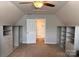 Bedroom with built-in shelving providing ample storage space at 7001 Conifer Cir, Indian Trail, NC 28079