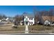 Exterior view of two-story home showcasing a well-maintained lawn and walkway to door at 7001 Conifer Cir, Indian Trail, NC 28079