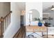 Bright foyer with wood floors, a staircase and a view into the living room at 7001 Conifer Cir, Indian Trail, NC 28079
