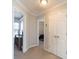 Hallway with carpet and doorways to other rooms at 7001 Conifer Cir, Indian Trail, NC 28079