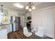 Bright kitchen with stainless steel appliances, granite countertops, and white cabinetry at 7001 Conifer Cir, Indian Trail, NC 28079
