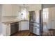 Beautifully updated kitchen with stainless steel appliances and granite countertops at 7001 Conifer Cir, Indian Trail, NC 28079