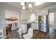 Bright, open kitchen featuring stainless steel appliances, white cabinets, and a view into the dining room at 7001 Conifer Cir, Indian Trail, NC 28079