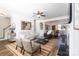 Open-concept living space with dining area, fireplace, and well-appointed furniture at 7001 Conifer Cir, Indian Trail, NC 28079