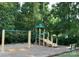 A playground with slides, swings, benches and a wood chip safety surface at 7001 Conifer Cir, Indian Trail, NC 28079