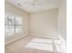 Neutral-toned bedroom with a ceiling fan, natural light, and plush carpeting at 7037 Ladys Secret Dr, Indian Trail, NC 28079