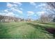 Expansive community park featuring lush green lawns, walking paths, and a central gazebo at 7037 Ladys Secret Dr, Indian Trail, NC 28079