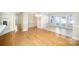 Open-concept living and dining area featuring hardwood floors, fireplace and abundant natural light at 7037 Ladys Secret Dr, Indian Trail, NC 28079