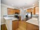 Modern kitchen with stainless steel appliances, granite countertops, and beautiful hardwood floors at 7037 Ladys Secret Dr, Indian Trail, NC 28079