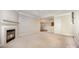 Open-concept living room featuring a fireplace and easy access to the kitchen area at 7037 Ladys Secret Dr, Indian Trail, NC 28079