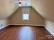 Finished attic space with laminate floors and a ceiling fan at 822 Wisteria Way, Salisbury, NC 28146