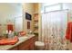 Bright bathroom featuring a vanity sink, toilet, and shower at 822 Wisteria Way, Salisbury, NC 28146