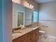 Bathroom featuring a double sink vanity with granite countertops and tile floors at 822 Wisteria Way, Salisbury, NC 28146