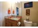 Bathroom featuring a vanity sink, toilet, and wall decor at 822 Wisteria Way, Salisbury, NC 28146