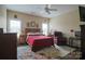 Spacious bedroom featuring a queen bed, complemented by a chair and end tables at 822 Wisteria Way, Salisbury, NC 28146