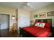 Cozy bedroom featuring a queen bed, complimented by a chair and closet at 822 Wisteria Way, Salisbury, NC 28146