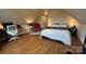 Spacious bedroom showcasing wood floors, a well-lit desk area, and a comfortable sleeping space at 822 Wisteria Way, Salisbury, NC 28146