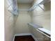 Walk-in closet with installed shelving for optimal storage and organization at 822 Wisteria Way, Salisbury, NC 28146