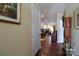 Open foyer leading into a spacious dining and living area with hardwood floors and abundant natural light at 822 Wisteria Way, Salisbury, NC 28146