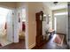 Inviting foyer showcasing hardwood floors, a grandfather clock, and seamless access to the home's layout at 822 Wisteria Way, Salisbury, NC 28146