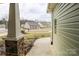 A glimpse of the well-kept street and lawns of neighboring houses from the front porch at 822 Wisteria Way, Salisbury, NC 28146