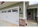 Inviting home exterior featuring a two-car garage and covered front porch, perfect for enjoying outdoor living at 822 Wisteria Way, Salisbury, NC 28146