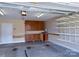 Spacious garage with built-in cabinets and shelving for storage at 822 Wisteria Way, Salisbury, NC 28146