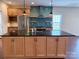 Stylish kitchen with an island, stainless steel appliances, dark countertops, and ample cabinetry at 822 Wisteria Way, Salisbury, NC 28146