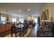 Spacious open-plan living and dining area with hardwood floors, fireplace, and ample seating at 822 Wisteria Way, Salisbury, NC 28146