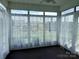 Bright sunroom featuring lots of windows, offering plenty of natural light and peaceful views at 822 Wisteria Way, Salisbury, NC 28146