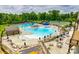 Aerial view of a resort-style pool area with multiple pools, seating, and surrounding lush greenery at 844 Braddock Way, Fort Mill, SC 29715