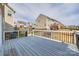 Back deck with black metal railing surrounding a fenced backyard at 844 Braddock Way, Fort Mill, SC 29715