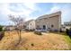Exterior backyard showcasing the deck, built-in grill, and fenced-in yard at 844 Braddock Way, Fort Mill, SC 29715