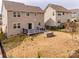 Expansive backyard featuring a deck, a built-in grill, and a well-maintained lawn, ideal for relaxation at 844 Braddock Way, Fort Mill, SC 29715