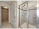 Contemporary shower with glass door and tile surround near walk-in closet at 844 Braddock Way, Fort Mill, SC 29715