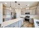 Modern kitchen features stainless steel appliances, gray cabinetry, and a large center island at 844 Braddock Way, Fort Mill, SC 29715